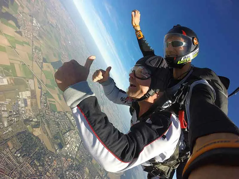 Parachutists happy in the air at Le Puy-en-Velay; Haute-Loire, Auvergne