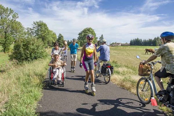 People cycle, rollerblade and stroll on the via fluvia in Haute-Loire