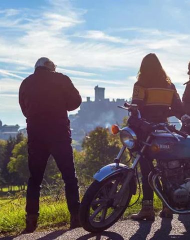 Biker friends on the bass side to contemplate the view of the Polignac fortress in Haute-Loire