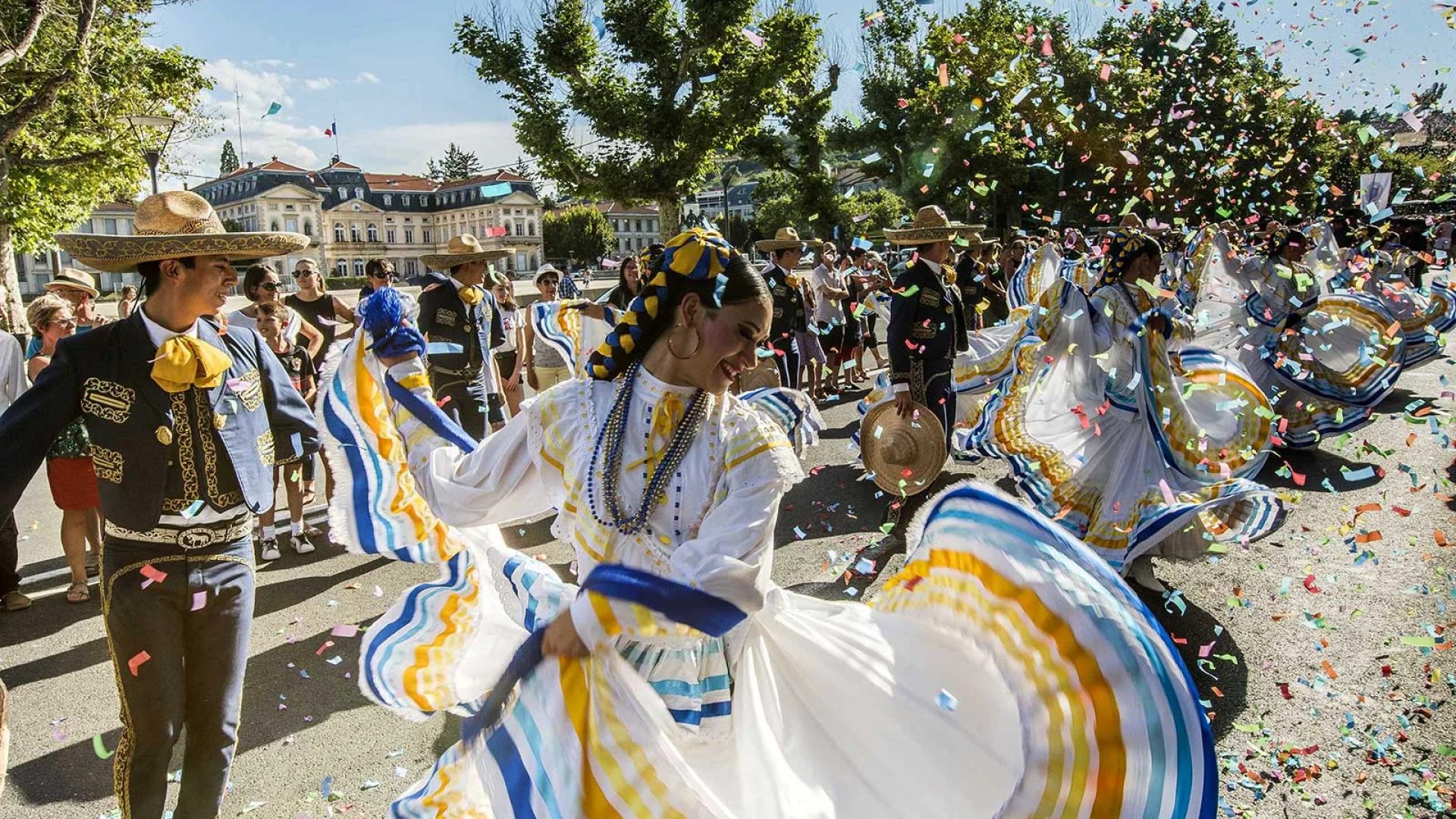 A group of Hispanic folk dancers perform in a street in Le Puy-en-Velay for the Interfolk festival in Haute-Loire, Auvergne