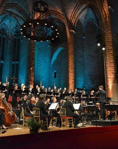 An orchestra performing in the abbey of La Chaise-Dieu for the Festival Le Chant des Sucs in Haute-Loire, Auvergne