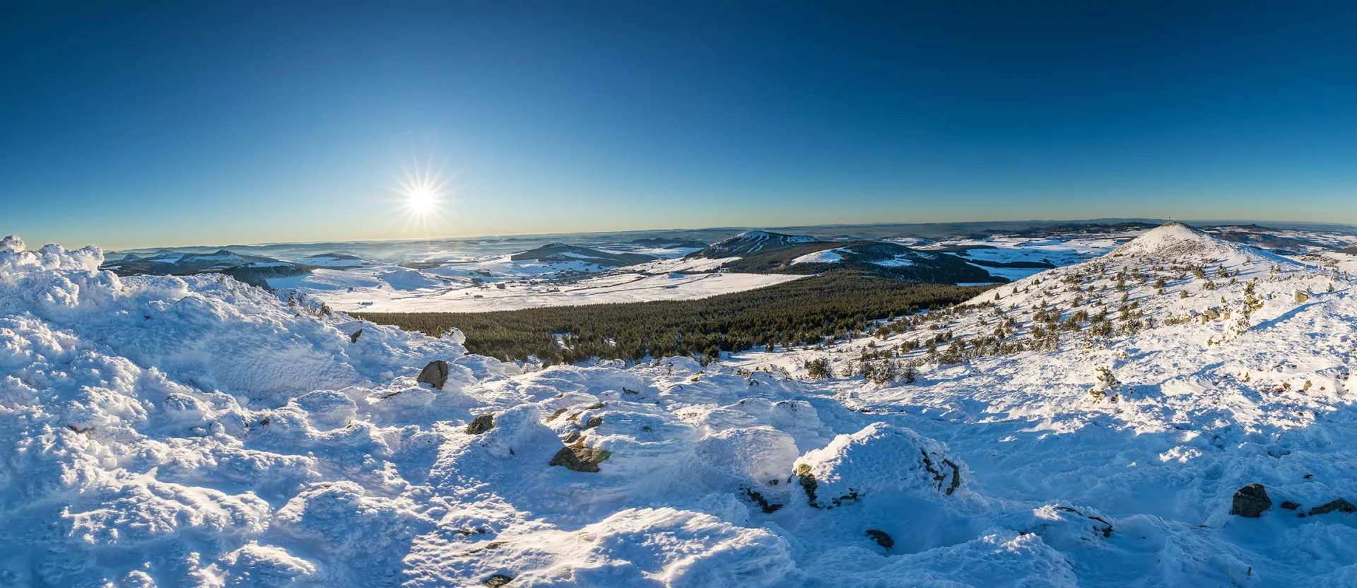 Panoramic view of snow-capped Meygal and Mézenc in Haute-Loire, Auvergne