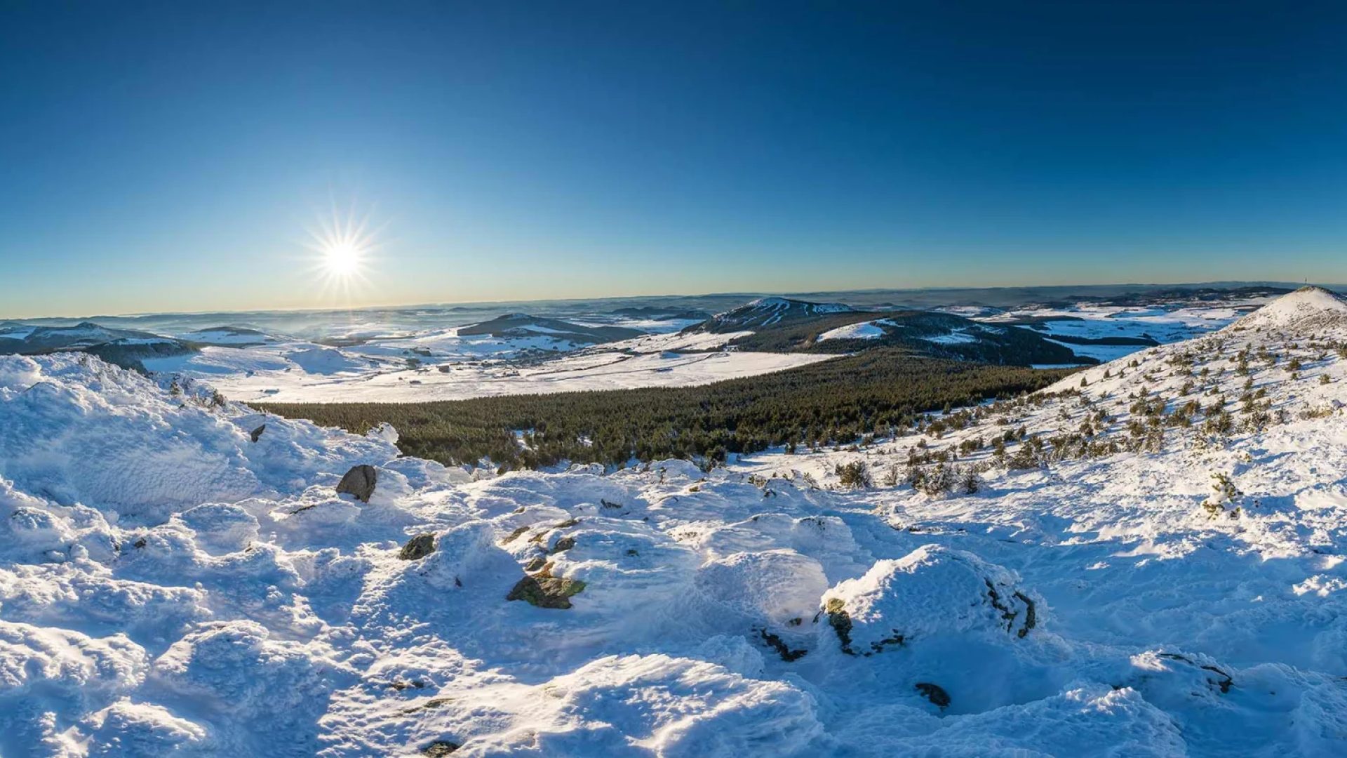 Panoramic view of snow-capped Meygal and Mézenc in Haute-Loire, Auvergne