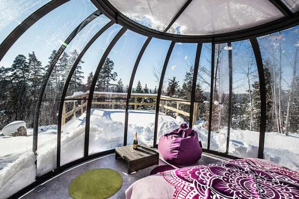 Unusual accommodation in a glass dome in winter under the snow in Haute-Loire, Auvergne