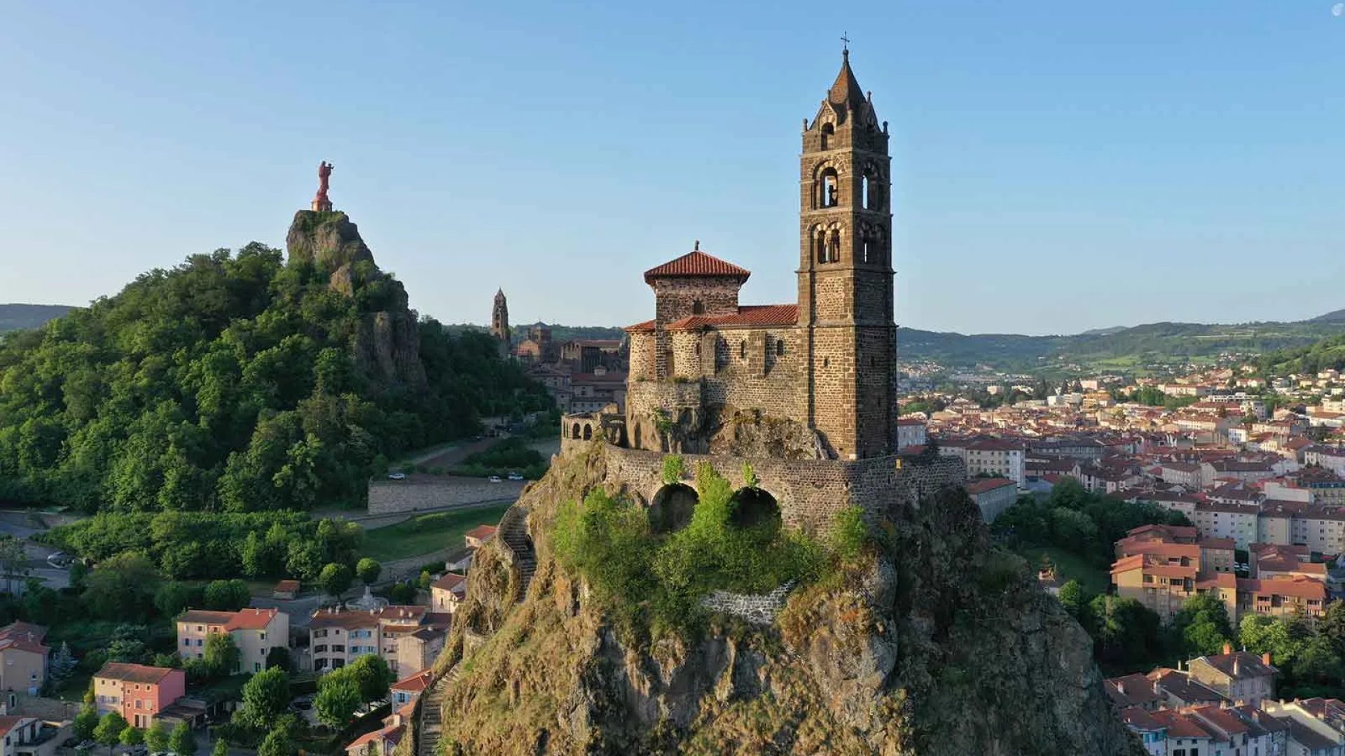 View of the Rocher Saint-Michel d'Aiguilhe, the Notre-Dame de France statue and the Puy-en-Velay in Haute-Loire, Auvergne