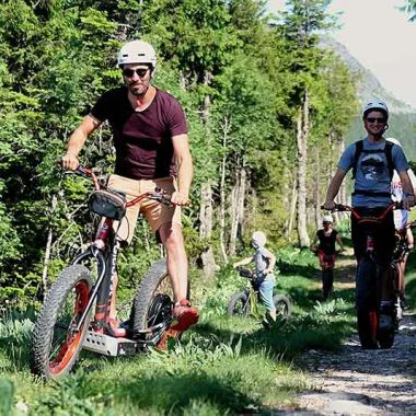 Group on all-terrain electric scooters in the forest in Haute-Loire, Auvergne